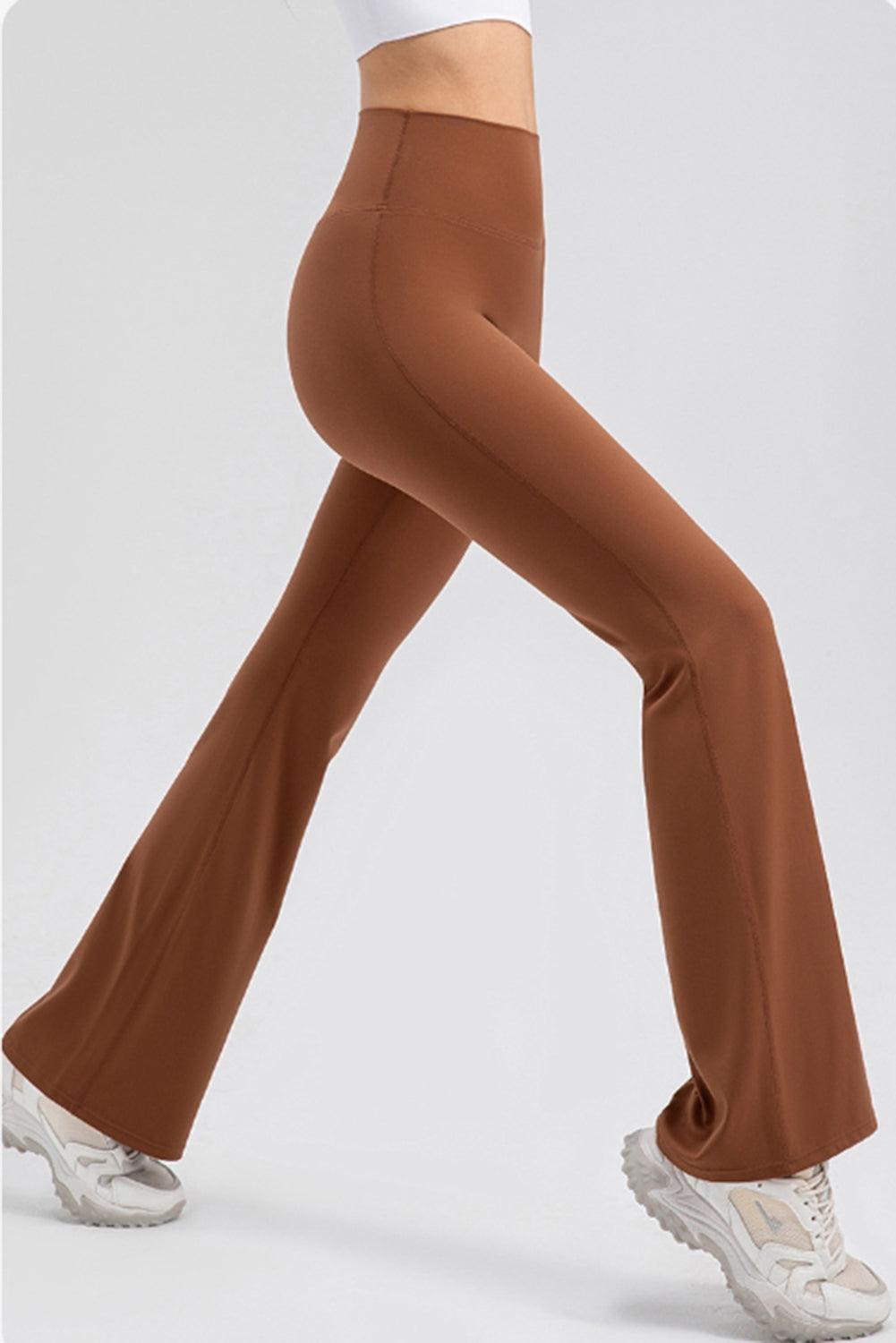 Caramel flare leggings with a high waist and performance fit, shown with white sneakers.