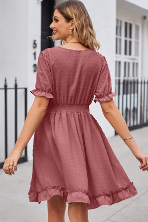 Dusty Pink textured dot puff sleeve fit-and-flare dress with smocked waist and ruffled hem.