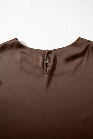 Brown satin maternity blouse with keyhole back detail and button closure.