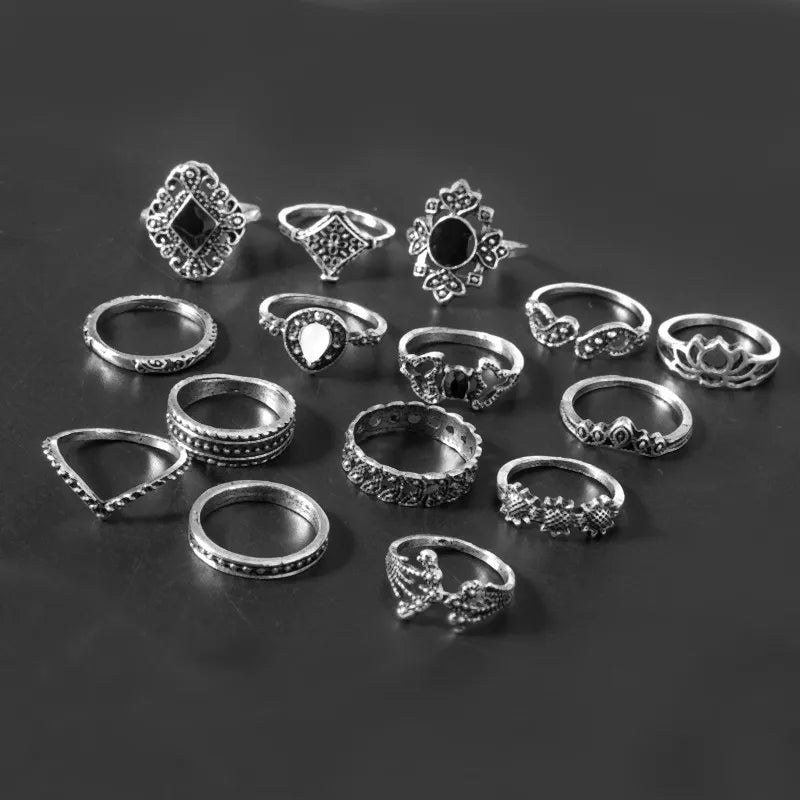 Bohemian silver rings with intricate designs and black and white stones.
