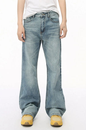 Wide leg denim bell bottom jeans in medium wash, featuring a relaxed fit and flared leg opening.