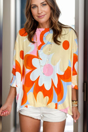 Retro floral ribbed blouse with short sleeves and a relaxed fit, featuring a vibrant abstract flower print.