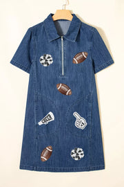 Denim mini dress in dark blue with football and cheer patches, short sleeves, collar, and zip front.