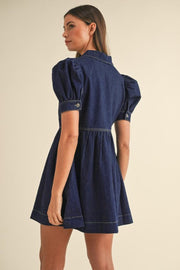 Dark denim mini dress with puff sleeves and A-line skirt.
