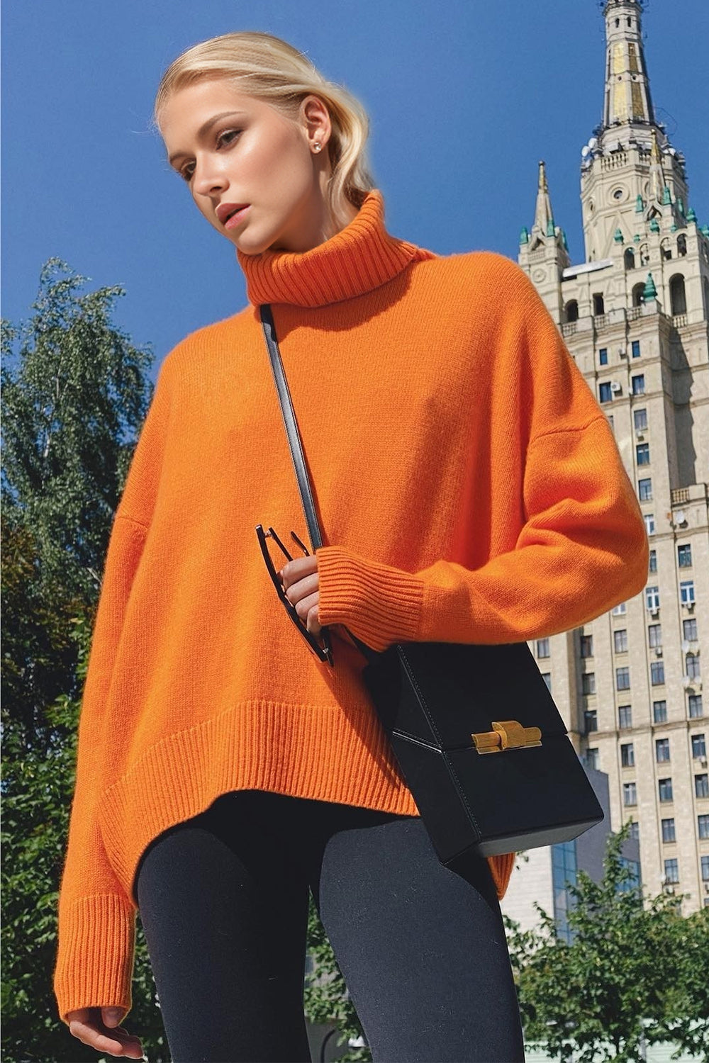 Orange oversized cashmere turtleneck sweater with ribbed cuffs and hem.