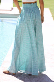 Aqua botanical print palazzo trousers with smocked waist and wide leg.