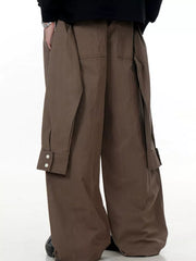 Brown wide-legged cargo pants with buttoned flap pockets and drawstring ankles.
