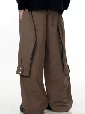 Brown wide-legged cargo pants with buttoned flap pockets and drawstring ankles.
