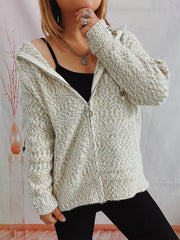 Speckled knit relaxed zip-up hoodie in cream with a textured pattern and cream zipper.