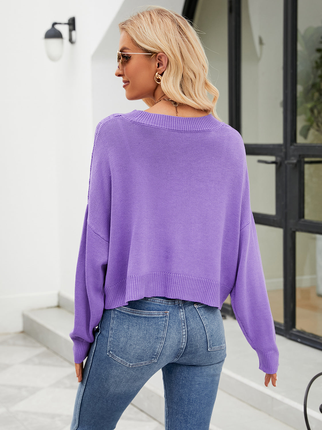 Purple cropped V-neck knit cardigan with ribbed hem and cuffs.