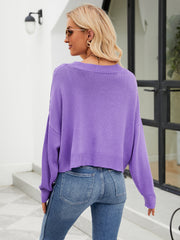 Purple cropped V-neck knit cardigan with ribbed hem and cuffs.