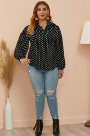 Black polka dot blouse with shirred balloon sleeves and a collared neckline.