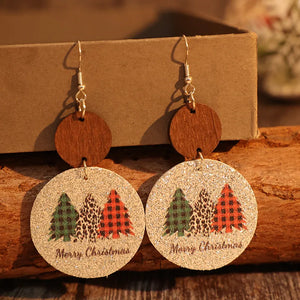 Festive tree print drop earrings with wood accents and Merry Christmas text.