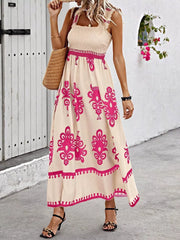 Smocked square neck maxi dress in tan with pink floral print, a-line cut, and ruffled straps.