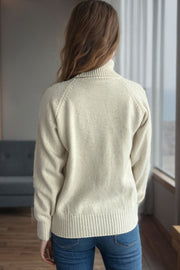 Cream speckled Donegal turtleneck pullover sweater with ribbed cuffs and hem