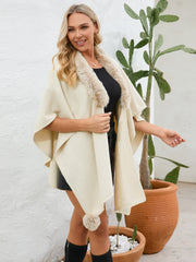 Cream faux fur collar wrap poncho with pom-pom detail and open front.