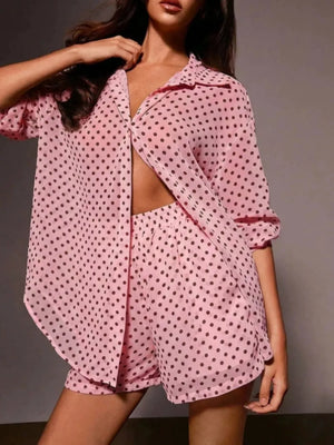 Pink polka dot sheer two-piece set with collared button-up shirt and shorts.