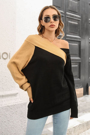 Black and camel asymmetric shoulder-baring knit sweater with ribbed trim.