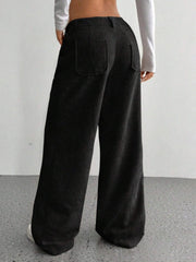 Black corduroy wide-leg utility trousers with back pockets.