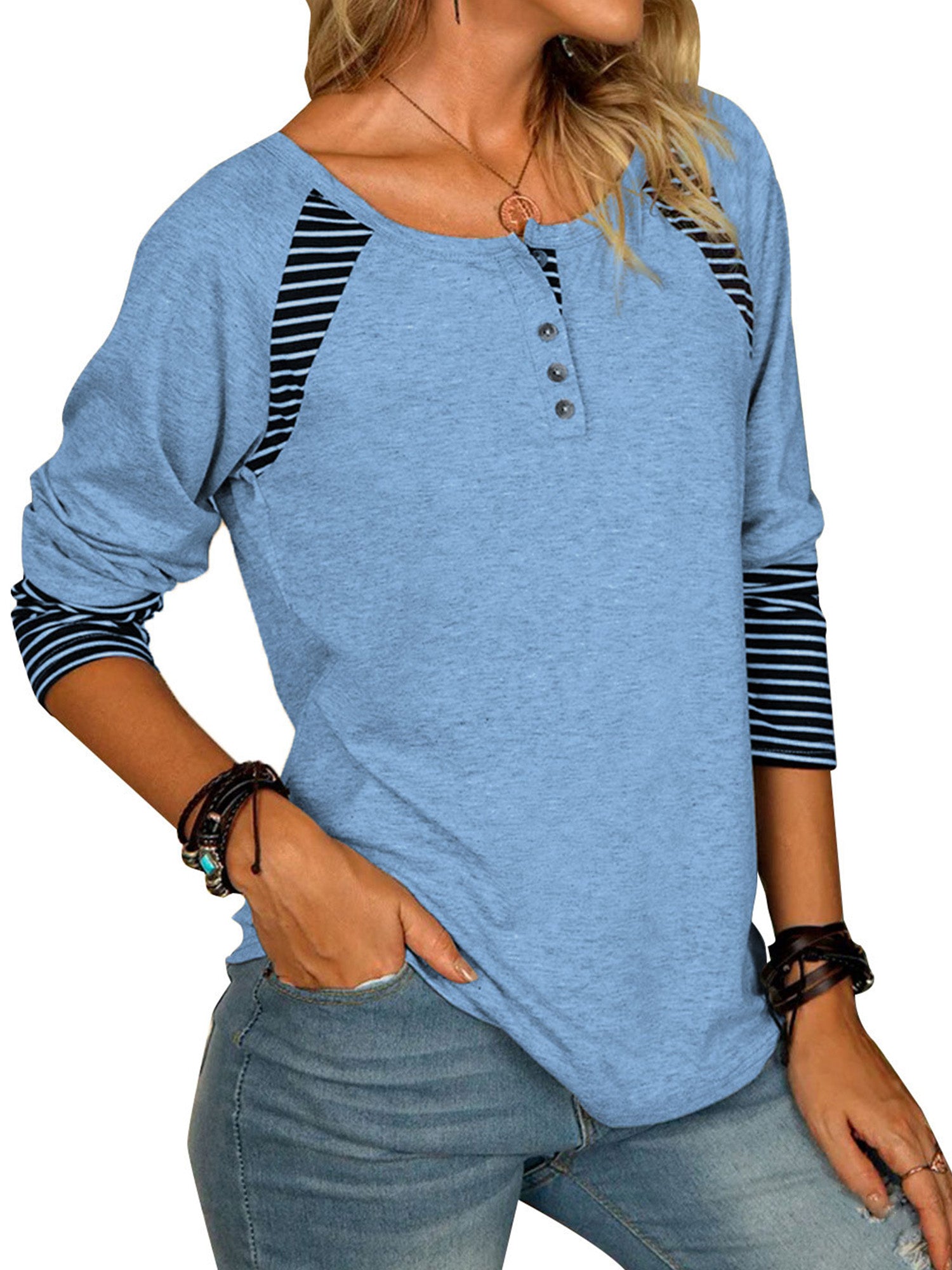 Light blue henley tee with striped raglan sleeves and button neckline
