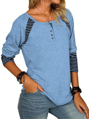 Light blue henley tee with striped raglan sleeves and button neckline