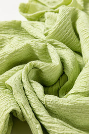 Lime textured collared romper with patch pocket, close-up of fabric detail