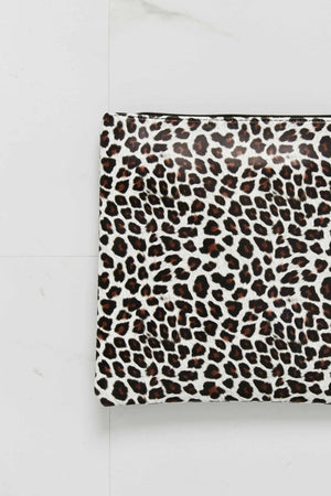 Leopard print clutch bag with zipper closure