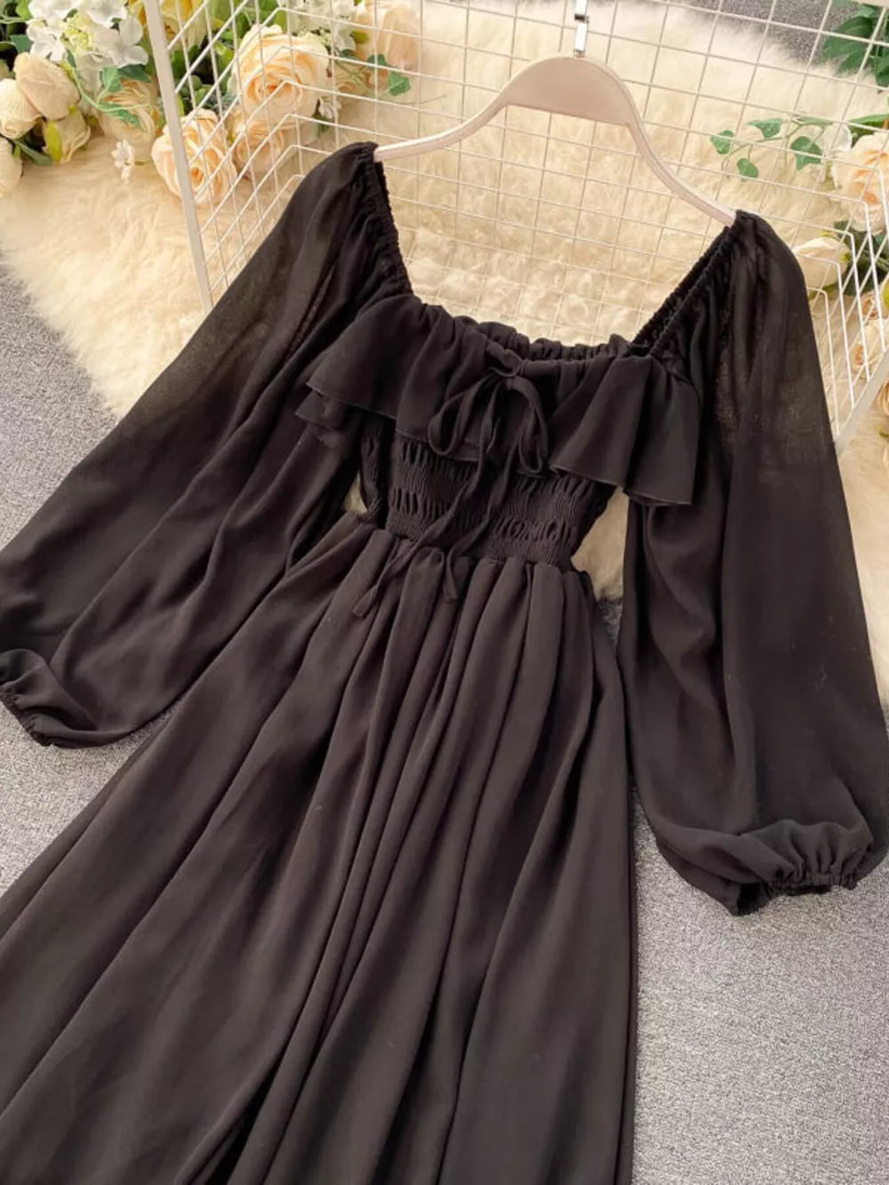 Black ruffled square neck maternity dress with balloon sleeves and tie detail
