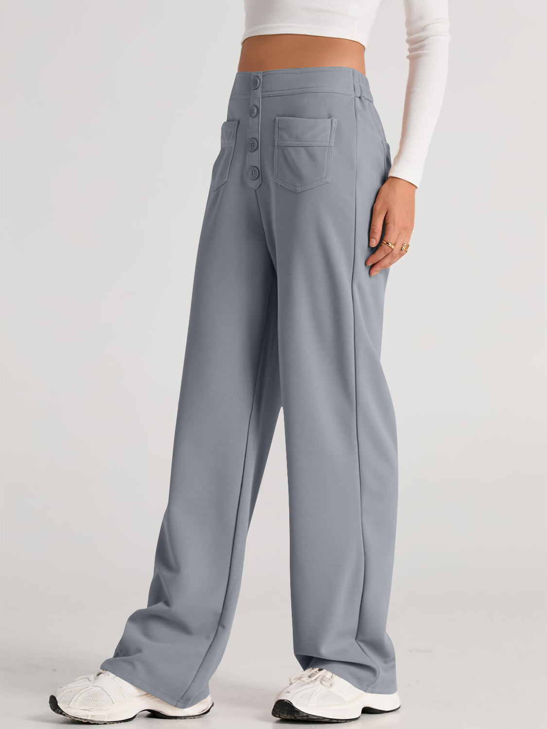 Button-front palazzo trousers in gray with wide legs and pocket details.