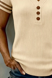 Cream ribbed knit tunic with V-neck and three brown buttons, short sleeves with stripes