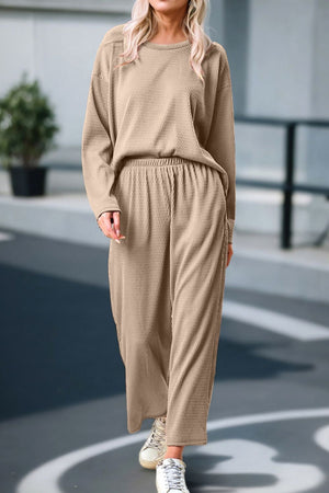 Khaki textured knit loungewear set with crew neck top and wide leg pants.