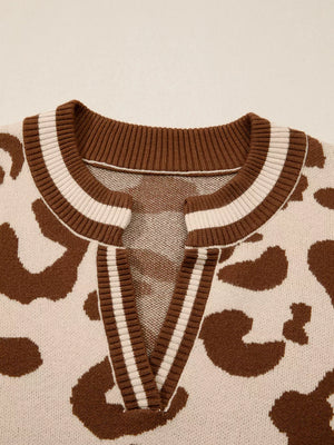 Chic leopard print knit sweater with a notched V-neck and striped trim.