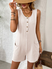 Ribbed knit button-front romper in eggshell with scoop neck, sleeveless, and patch pockets.