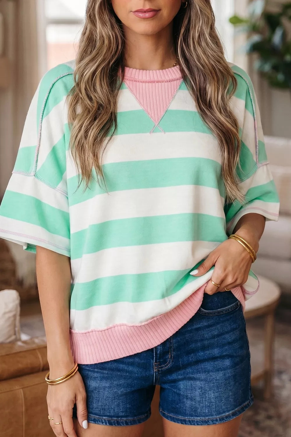 Playful Patchwork Oversized T-shirt with green and white stripes, pink neckline, and exposed seams.