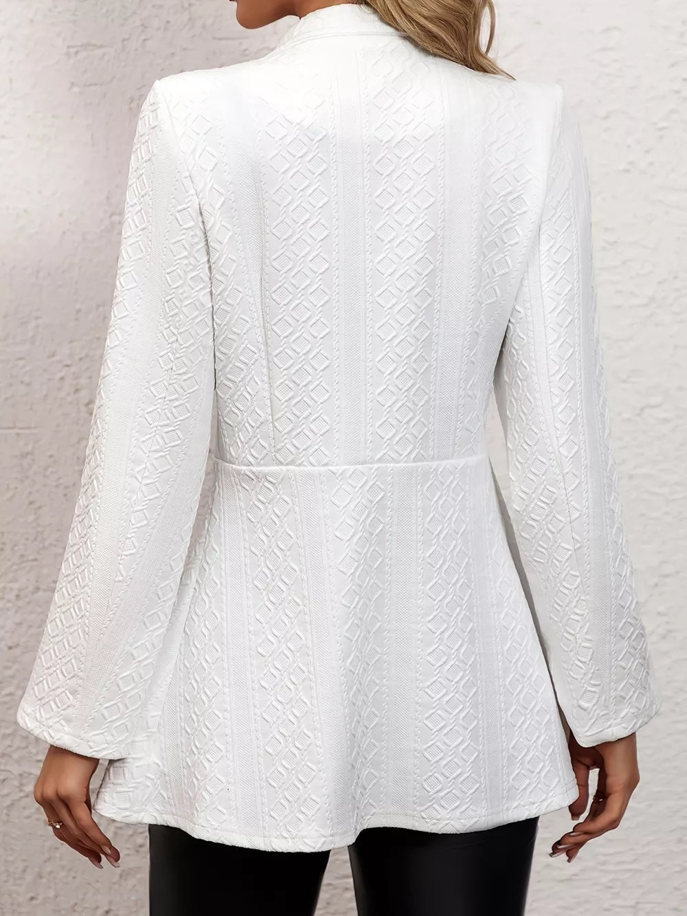 White textured slim fit open blazer with a geometric pattern and flared sleeves.