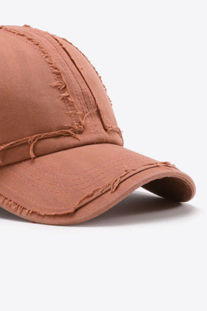 Burnt Coral raw edge denim baseball cap with distressed details