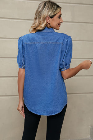 Royal blue denim button-down shirt with puff sleeves and collared neckline.