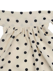 Apricot polka dot halter mini dress with ruffled neckline detail
