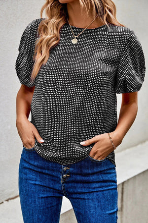 Black micro-dot puff sleeve blouse with a round neckline.