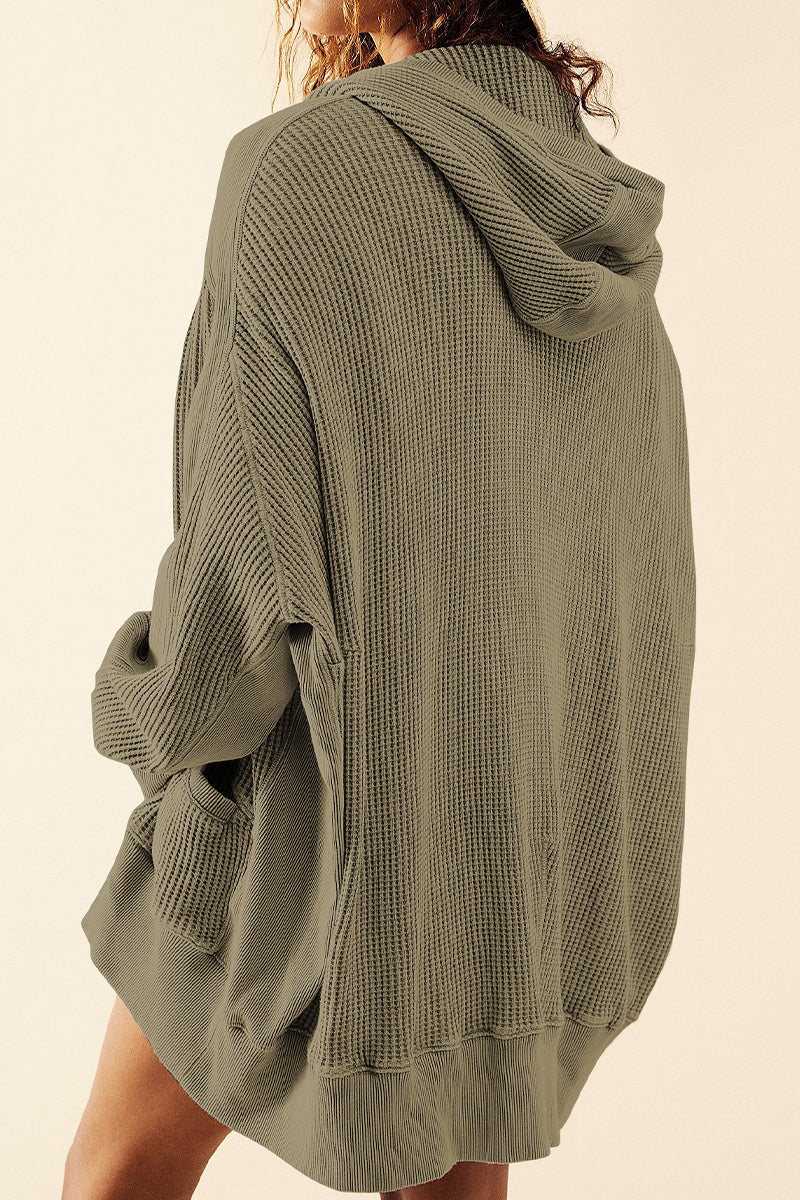 Army green waffle knit hooded zip-through jacket with pockets.