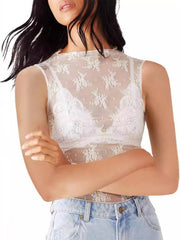 White sheer lace mock neck tank top with floral pattern, worn over a white bra.