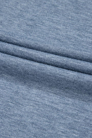 Denim-trimmed wide-leg utility jumpsuit in dusty blue heathered knit fabric.