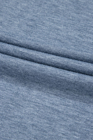 Denim-trimmed wide-leg utility jumpsuit in dusty blue heathered knit fabric.