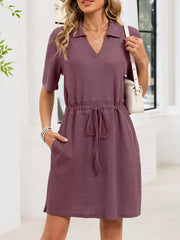 Textured polo dress in pink with adjustable drawstring waist and short sleeves.