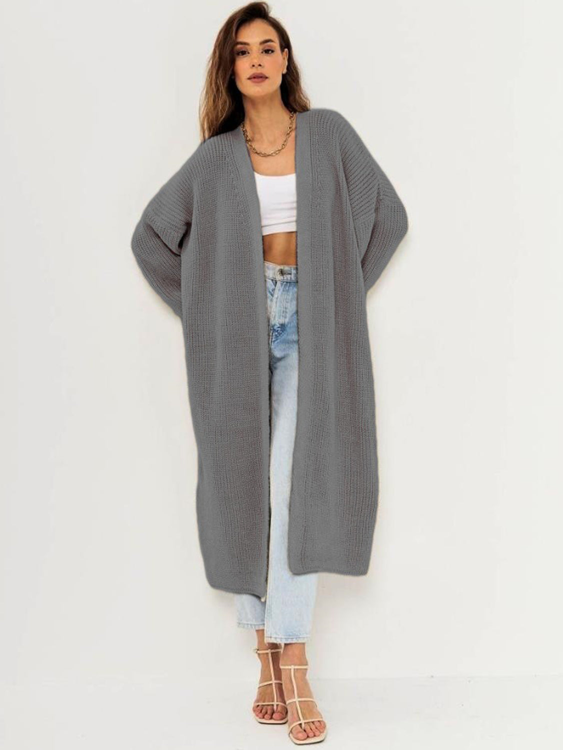Oversized gray ribbed knit maxi cardigan with open front and long sleeves.