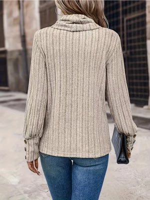 Ribbed cowl neck sweater in tan with button cuff details and long sleeves.