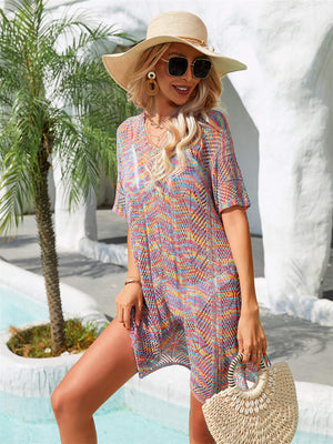 Openwork knit beach cover-up with colorful stripes and tassels, v-neck, short sleeves.