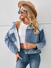 Denim trucker jacket with serpentine print panels and pockets.
