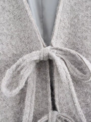 Silver gray textured knit tie-front cardigan with a fuzzy finish and tie detail.