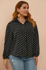 Black polka dot blouse with shirred balloon sleeves and a collared neckline.